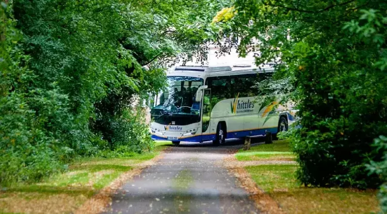 Whittles coach turning up lane